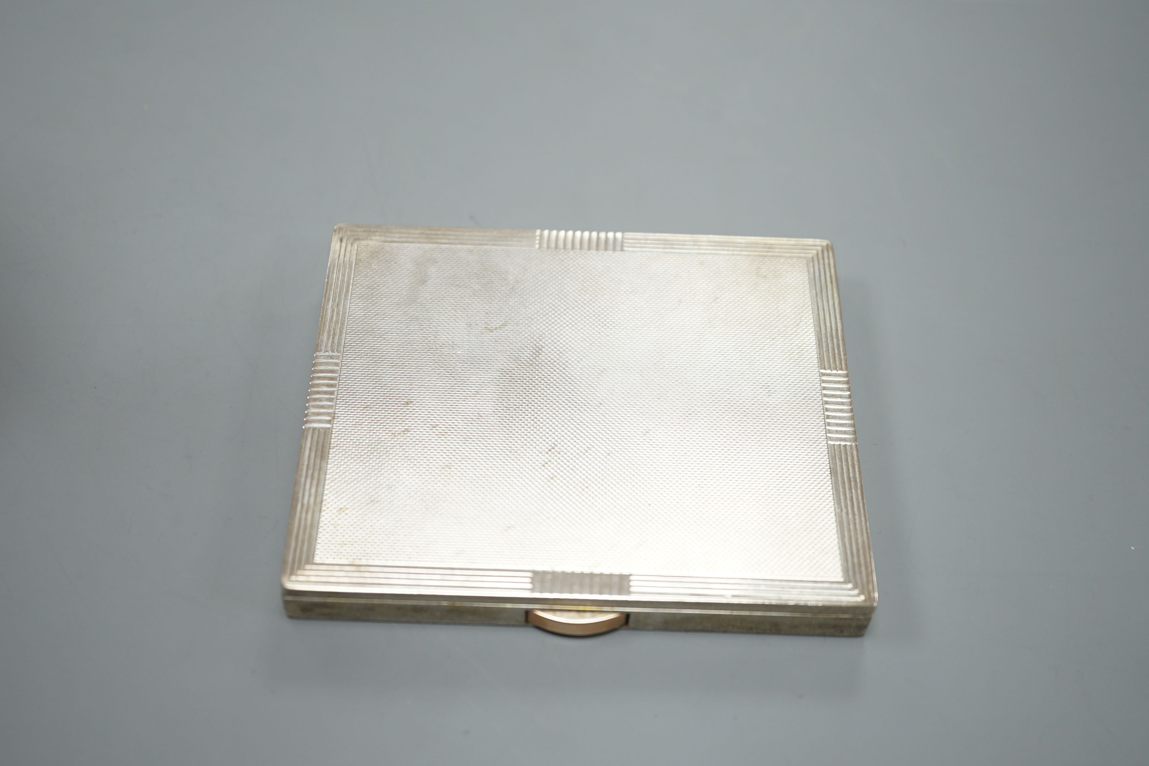 A George VI engine turned silver cigarette case, Birmingham, 1951, 96mm.